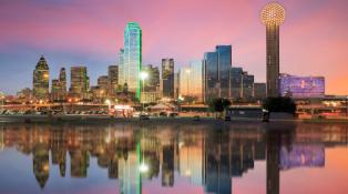 The sun sets on the colorful, neon skyline of Dallas. 